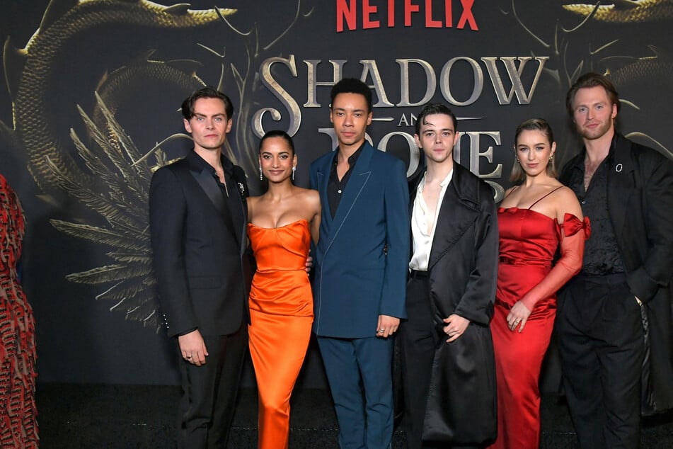 (From l to r) Freddy Carter, Amita Suman, Kit Young, Jack Wolfe, Danielle Galligan, and Calahan Skogman portray the six members of the Crows in Shadow and Bone.