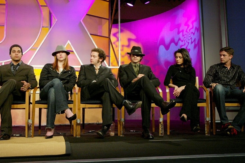 The original cast from That '70s Show: (from l. to r.) Wilmer Valderrama, Laura Prepon, Danny Masterson, Ashton Kutcher, Mila Kunis, and Topher Grace.