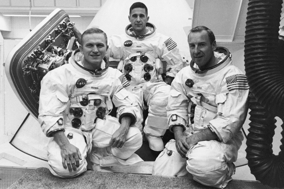 From l. to r.: Frank Borman, William Anders, and James Lovell pose together before launching on the Apollo 8 mission orbiting the Moon.