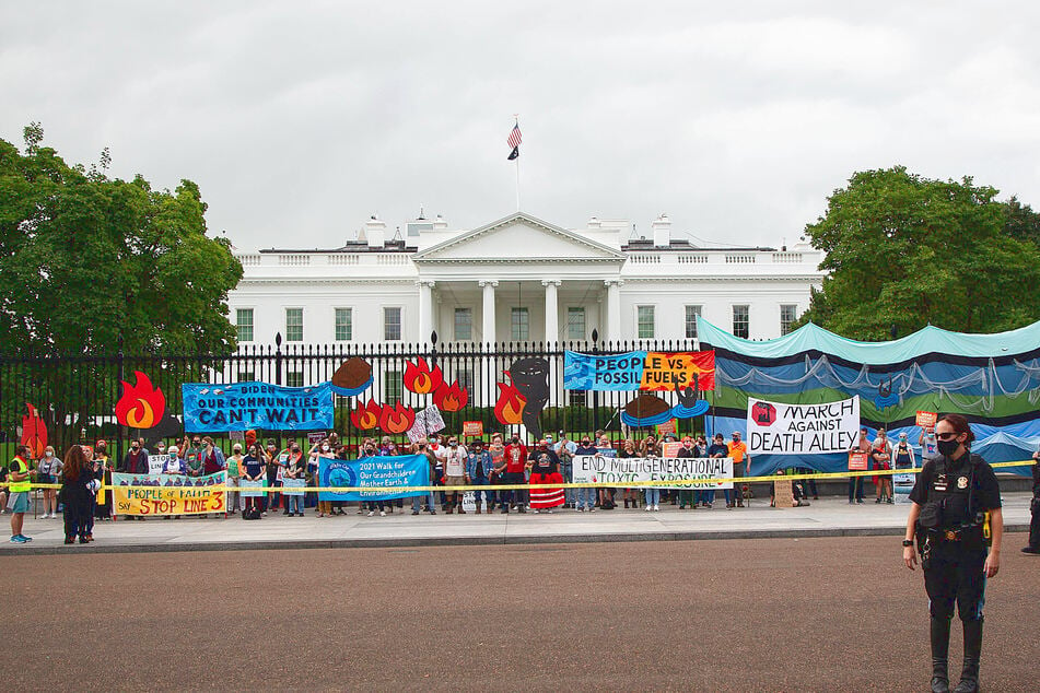 Hundreds of demonstrators gathered outside the White House on October 13 to call on President Biden to divest from fossil fuels and invest in a clean energy future.