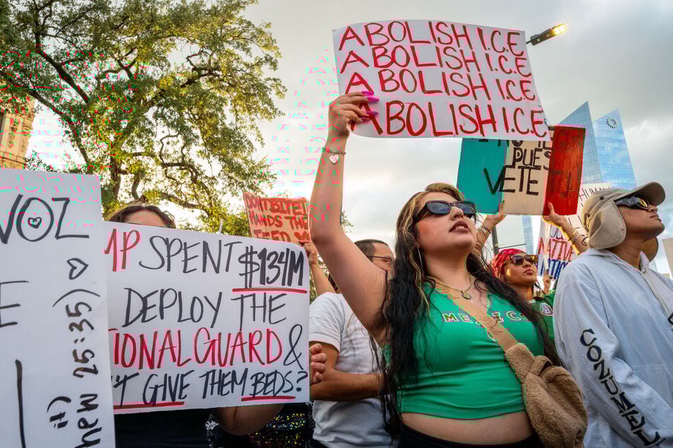 Demonstrators protest against US Immigration and Customs Enforcement raids at San Antonio City Hall in Texas on June 11, 2025.