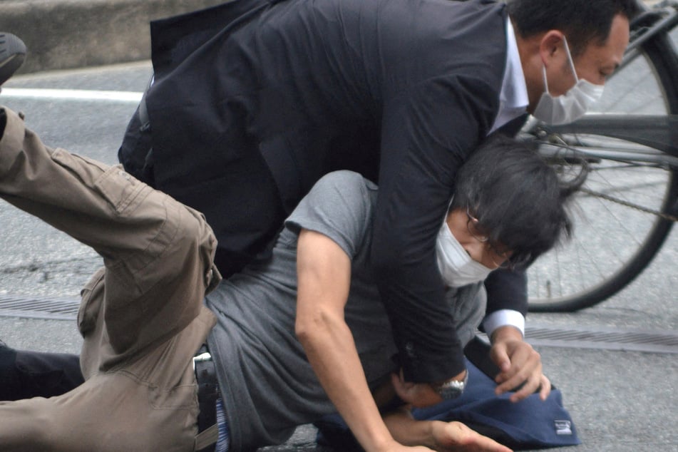 The suspect was tackled by Abe's security detail after the shooting.
