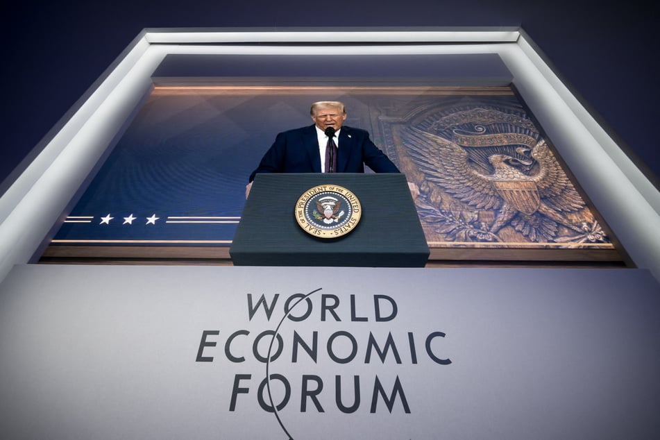 President Donald Trump is seen on a giant screen during his address by video conference at the World Economic Forum (WEF) annual meeting in Davos on January 23, 2025.