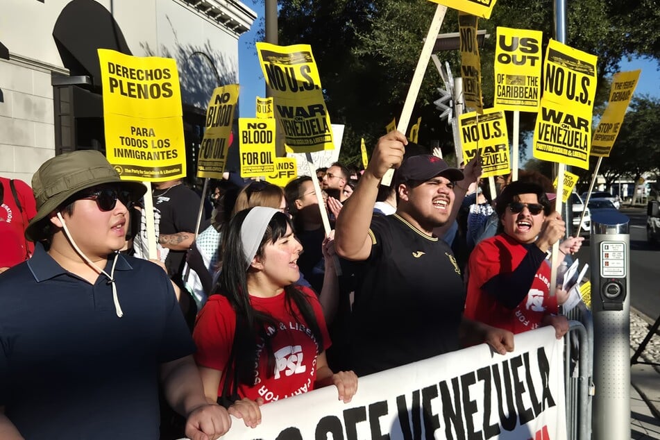 Protesters gather in Houston, Texas, in opposition to US aggression in Venezuela on January 4, 2026.