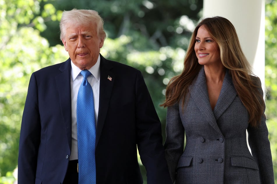 President Trump (l.) signed a bill on Monday making it a federal crime to post "revenge porn" – legislation endorsed by his wife Melania\.