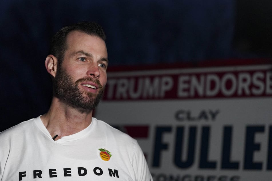 Clay Fuller, the Trump-endorsed Republican candidate for Georgia's 14th congressional district, speaks to members of the media after arriving early to his voting precinct in Lookout Mountain on March 10, 2026.