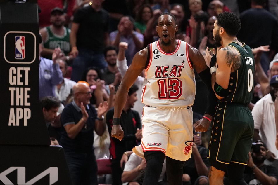 Bam Adebayo (l.) top-scored for the Miami Heat in their win over the Boston Celtics.