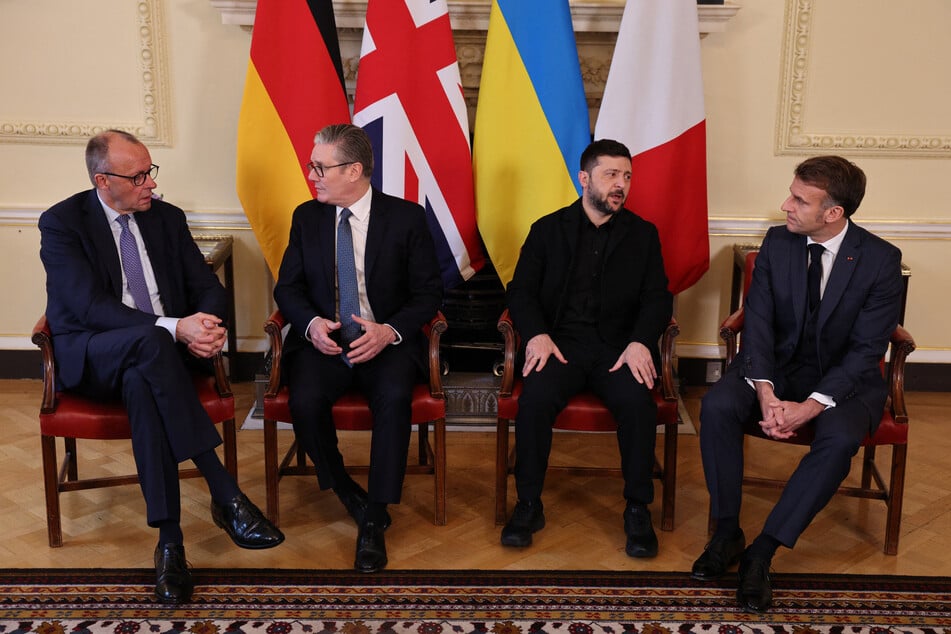 (L-R) Germany's Chancellor Friedrich Merz, Britain's Prime Minister Keir Starmer, Ukraine's President Volodymyr Zelensky and France's President Emmanuel Macron sit down ahead of a meeting inside 10 Downing Street in central London on Monday.