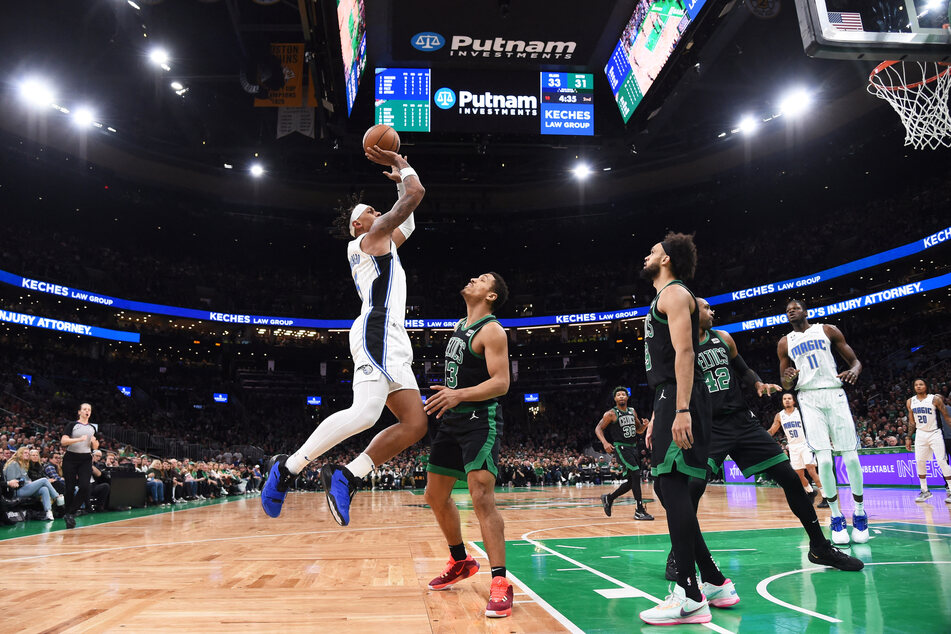 The Orlando Magic's Paolo Banchero rises to score against the Boston Celtics.