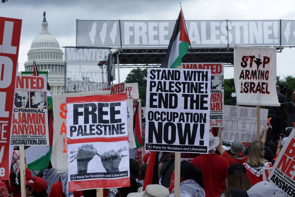 Demonstrators demand Palestinian freedom and an end to US support for Israel in a protest outside the US Capitol in Washington DC.
