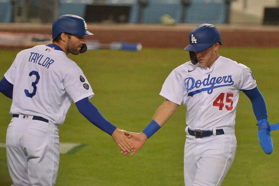 Los Angeles Dodgers Chris Taylor (l.) and Matt Beaty celebrate after scoring two runs in the sixth inning against the San Diego Padres.