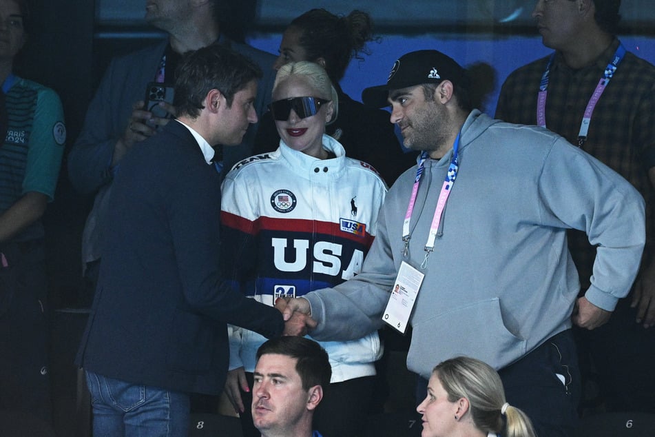 Lady Gaga (c.) introduced Michael Polansky (r.) to French Prime Minister Gabriel Attal (l.) as her "fiancé."