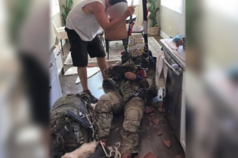 The soldier "landed" on the kitchen floor of the house, and seemed to have some injuries to his feet.