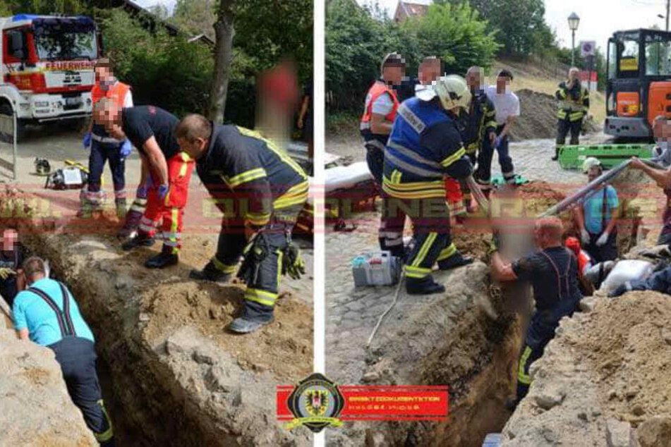 Mit bloßen Händen wurde der Bauarbeiter von zwei Feuerwehrleuten ausgegraben.