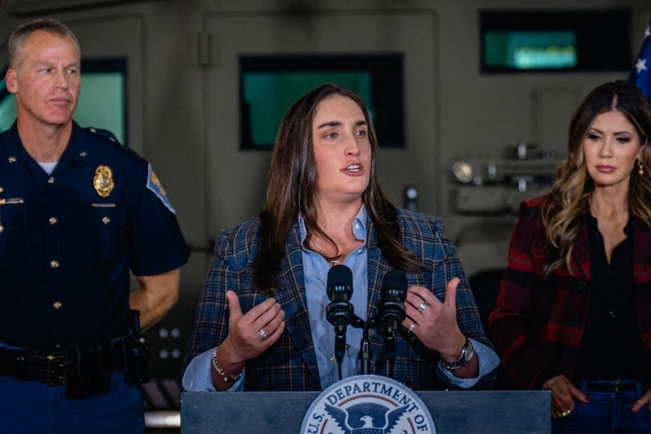 Madison Sheahan (c) speaks during a press conference with Homeland Security Secretary Kristi Noem (r) on October 30, 2025, in Gary, Indiana.