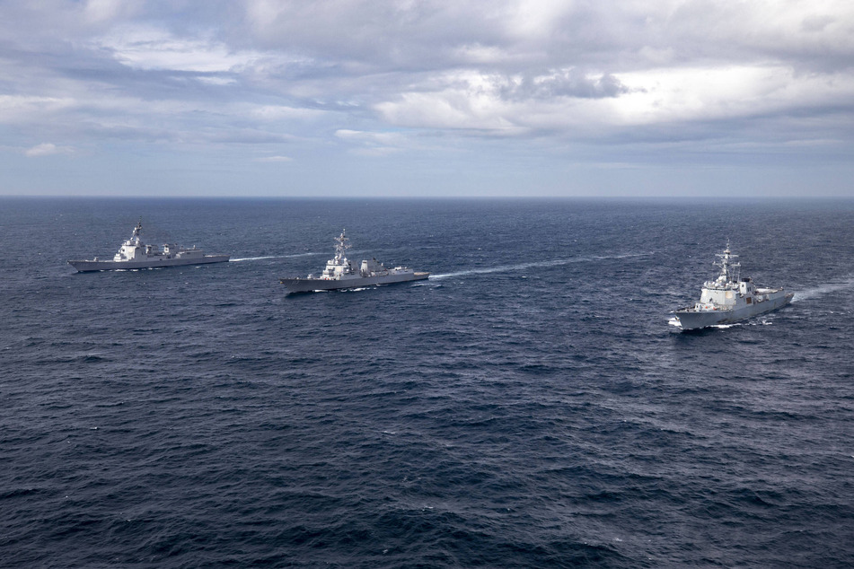 South Korean, US, and Japanese warships partake in a missile defense exercise in international waters prior to a US nuclear sub making its first port call in South Korea in decades.