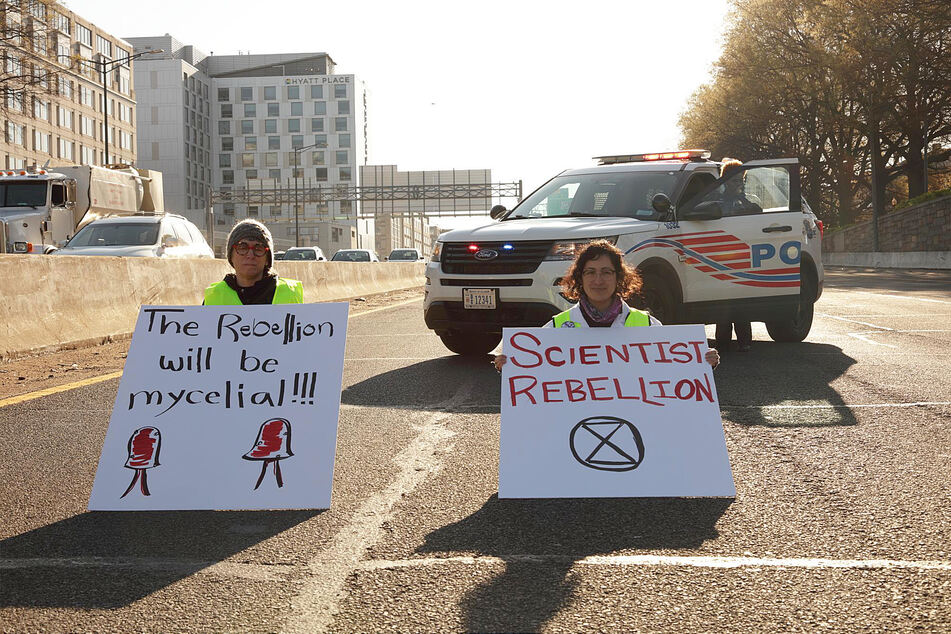 Dr. Rose Abramoff (right), protesting by blocking DC's I-395 at rush hour.