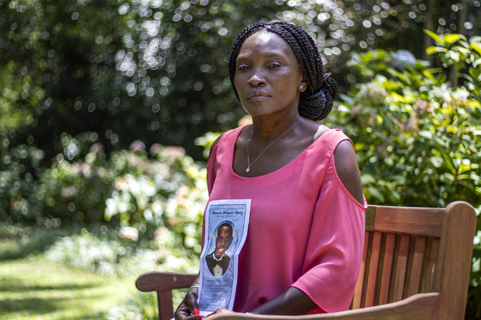 Wanda Cooper-Jones, the mother of Ahmaud Arbery, is photographed holding a photo of her late son at Pendleton King Park in Augusta, Georgia on July 24, 2020.
