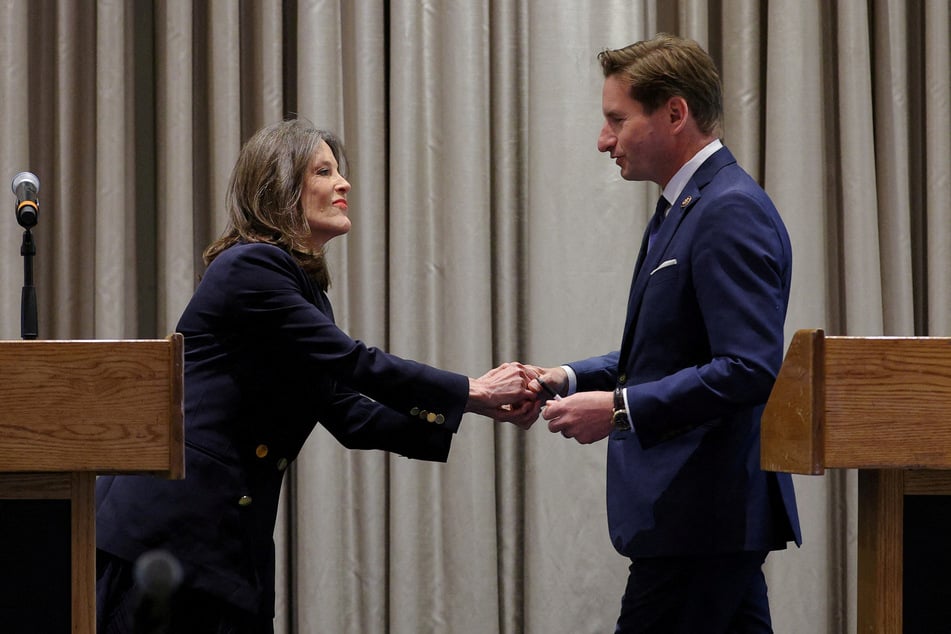 Marianne Williamson (l.) and Congressman Dean Phillips squared off in a Monday debate in New Hampshire as they vie to become the 2024 Democratic nominee for president.
