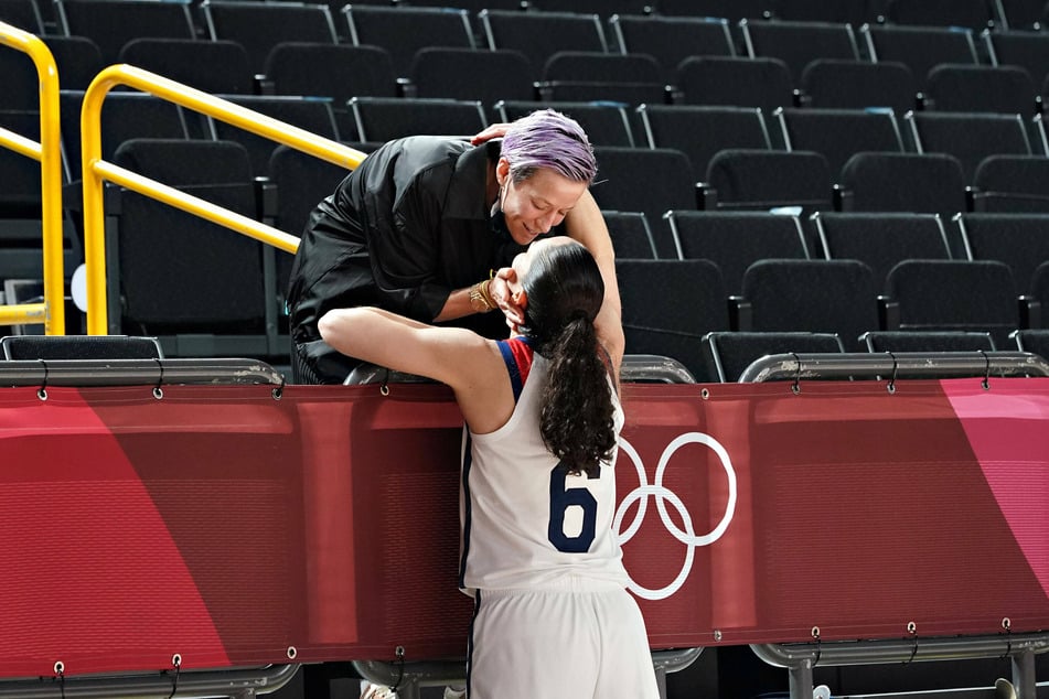 Megan Rapinoe congratulates her fiancee Sue Bird after the women's basketball final on Sunday.