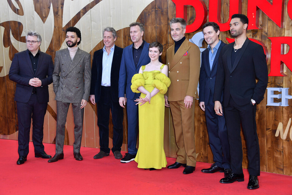 (From l to r) Jeremy Latcham, Justice Smith, Hugh Grant, Jonathan Goldstein, Sophia Lillis, Chris Pine, John Francis Daley, and Regé-Jean Page attend the premiere of Dungeons &amp; Dragons: Honor Among Thieves in Berlin.
