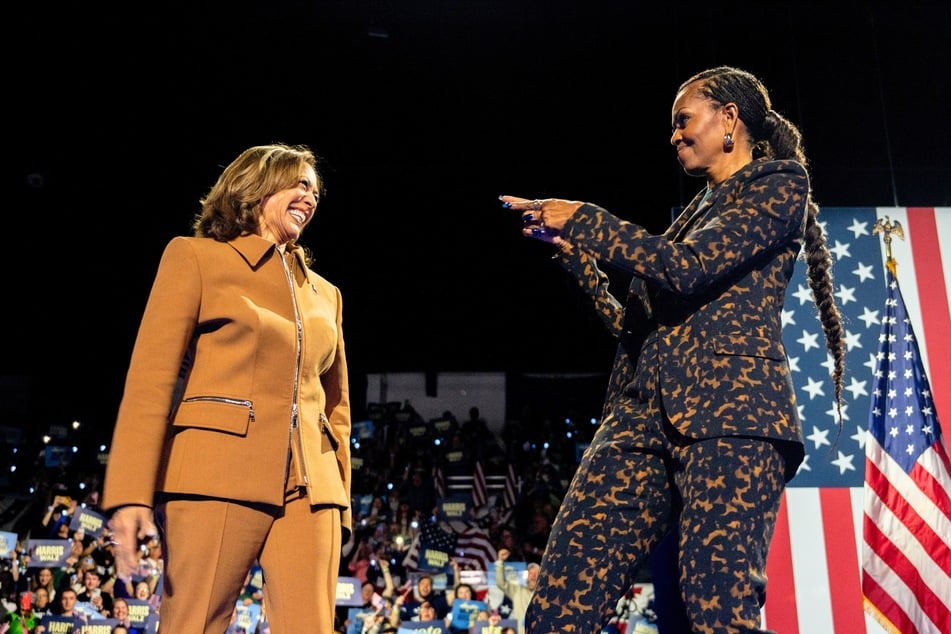 During a recent rally in support of Kamala Harris, former first lady Michelle Obama (r.) warned men thinking about sitting out this election.