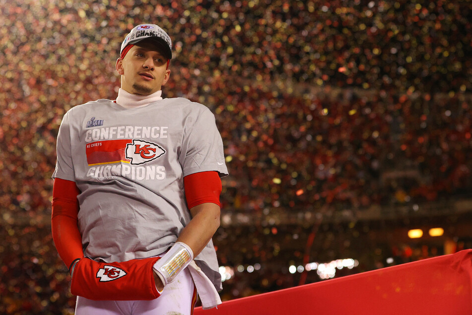 Patrick Mahomes looks on as confetti falls after Kansas City's AFC championship win.
