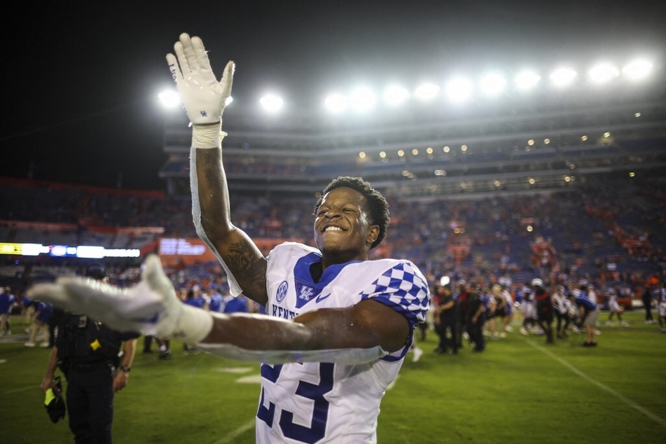 Andru Phillips of the Kentucky Wildcats celebrates after defeating the Florida Gators 26-16 in a game at Ben Hill Griffin Stadium.