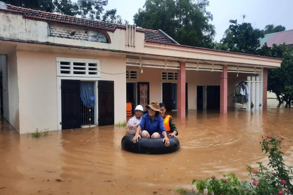 A woman was rescued from her home. At least 18 others did not survive the storm.