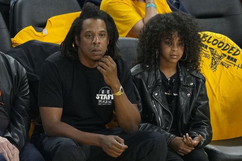 Jay-Z and his daughter, Blue Ivy, attending Game 5 between the Warriors and the Celtics.