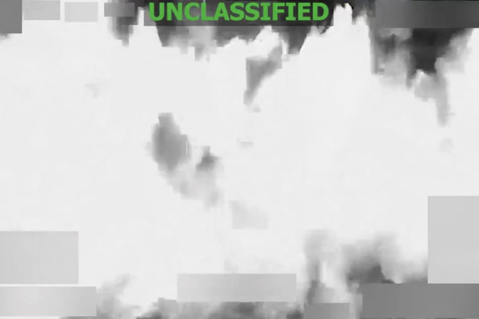 A screen grab from a video posted on the X account of US Southern Command shows a strike at the direction of Defense Secretary Pete Hegseth on a vessel in international waters on January 23, 2026.