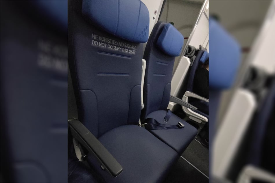 The passenger remained skeptical when a flight attendant explained to him that the seat could not be occupied because there was no seat belt.