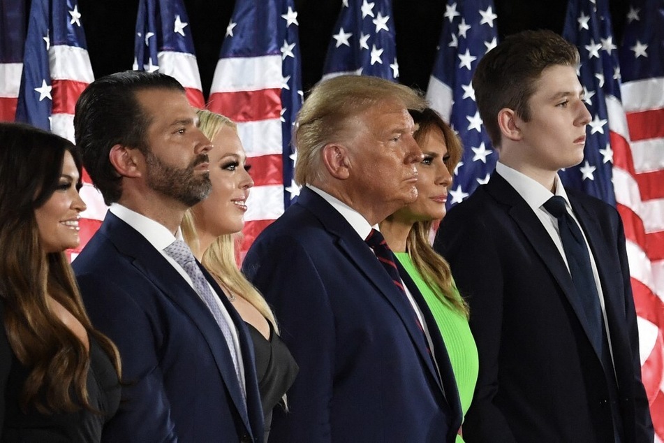 From r. to l.: Barron Trump, former first lady Melania Trump, ex-president Donald Trump, Tiffany Trump, Donald Trump Jr., and Kimberly Guilfoyle stand on stage on the final day of the 2020 Republican National Convention.