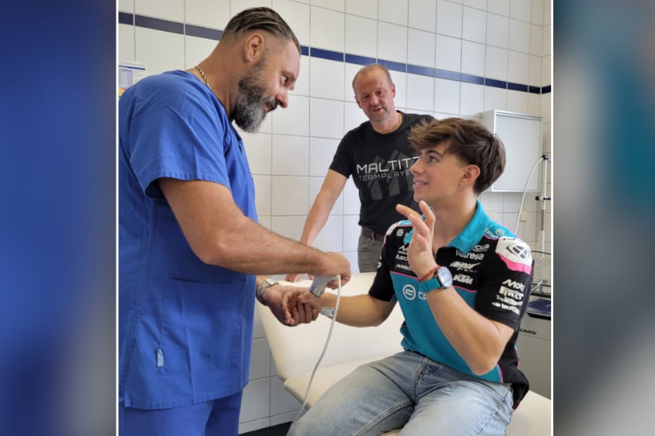 Facharzt für Orthopädie Sven Schirbock (l.) und Teamsponsor Dirk Maltitz (M.) unterstützen den Motorradrennfahrer David Alonso (19) nach seinem MotoGP-Sturz.