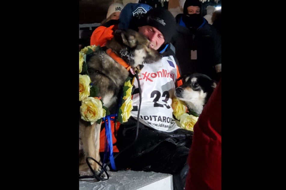 Dallas Seavey with his dogs after the 2021 Iditarod dog sled race.