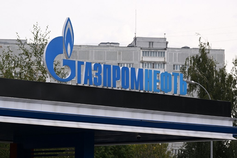 A gas station of the Russian oil producer Gazprom Neft is pictured in front of an apartment block in Moscow.