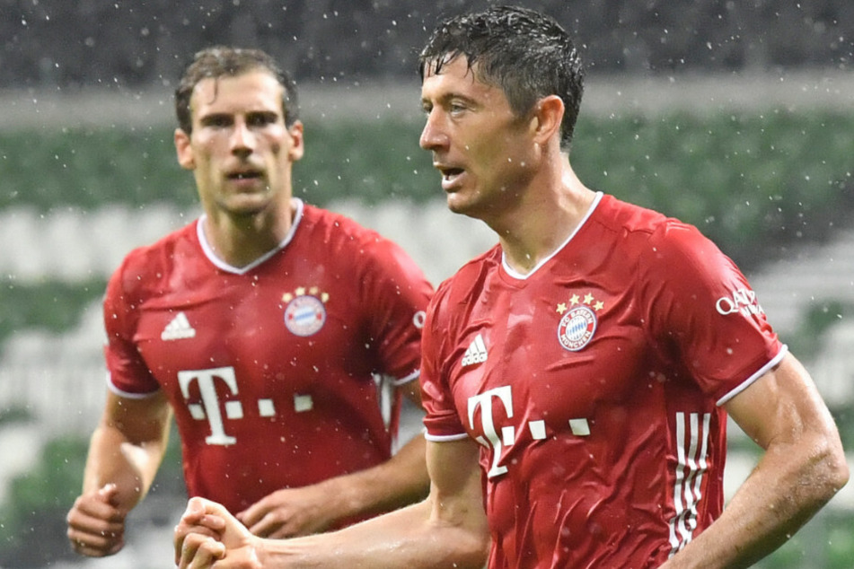 Robert Lewandowski (r.) und der FC Bayern sind Meister.