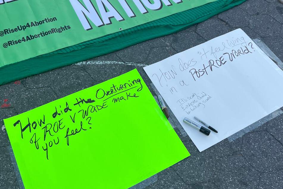 Protestors wrote messages on poster boards about how they felt about the overturning of Roe v. Wade.