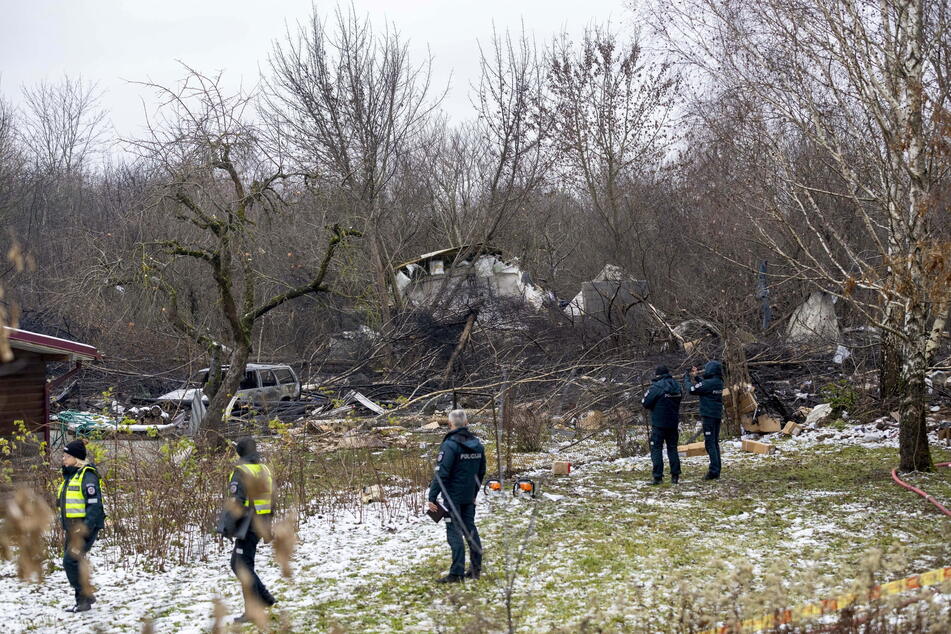 The crash site in Vilnius - Investigators retrieved the flight data recorder and cockpit voice recorder from the wreckage of the crashed cargo plane yesterday.