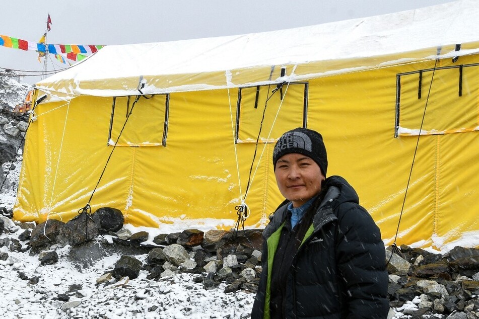 Phunjo Jhangmu Lama posing for photos at an Everest base camp.