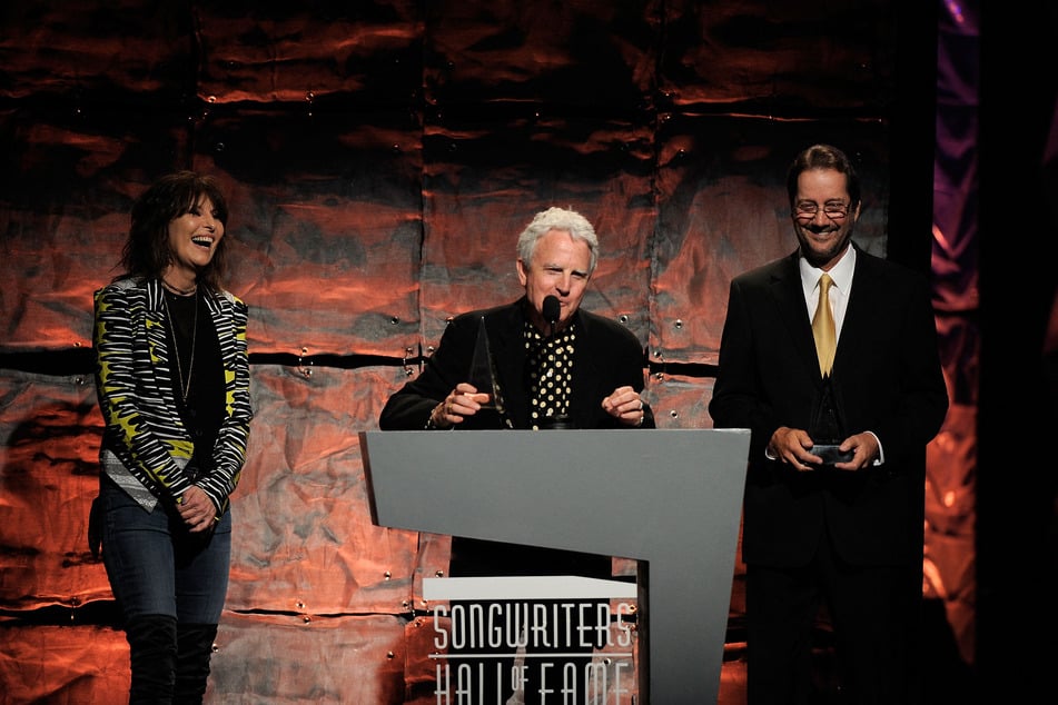 Billy Steinberg (c.) speaks onstage at the Songwriters Hall of Fame 42nd Annual Induction and Awards ceremony in New York City on June 16, 2011.