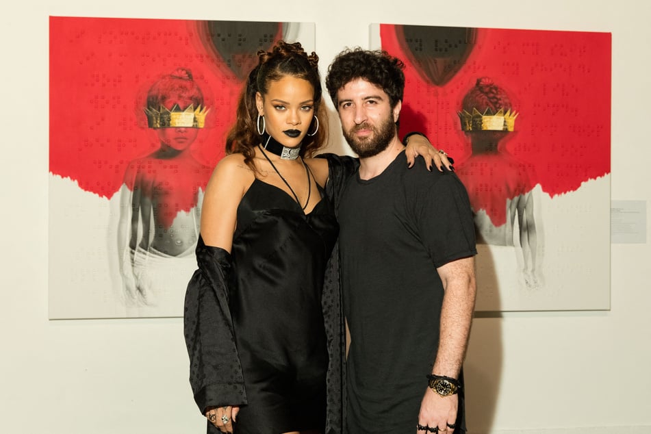 Singer Rihanna (l.) and artist Roy Nachum (r.) at Rihanna's 8th album artwork reveal for ANTI at MAMA Gallery on October 7, 2015 in Los Angeles, California.