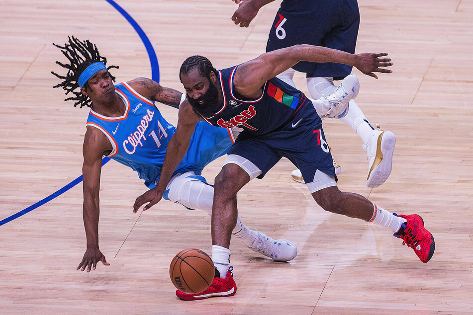 James Harden (r.) scored 29 points with a season-high 15 rebounds against the Clippers.