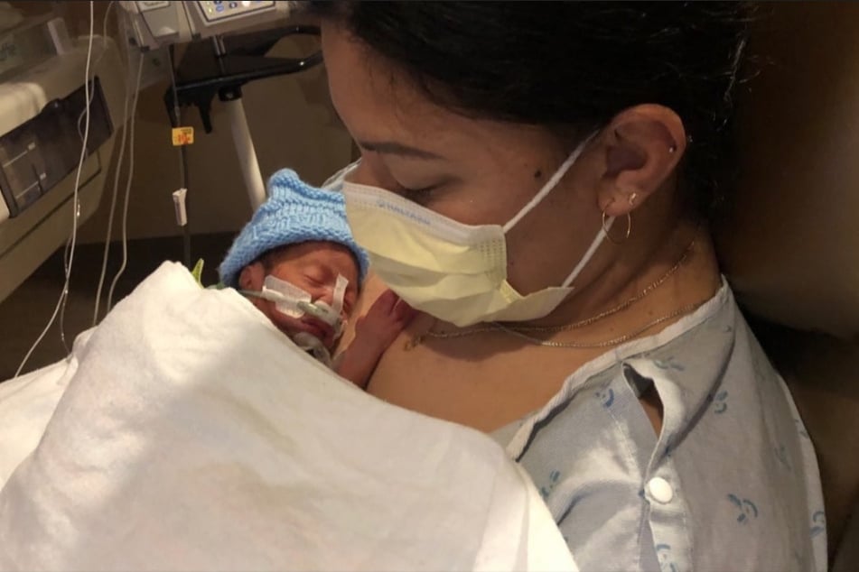 Lavi and her premature son at the hospital in Honolulu after he was born over the Pacific Ocean on a Delta flight.