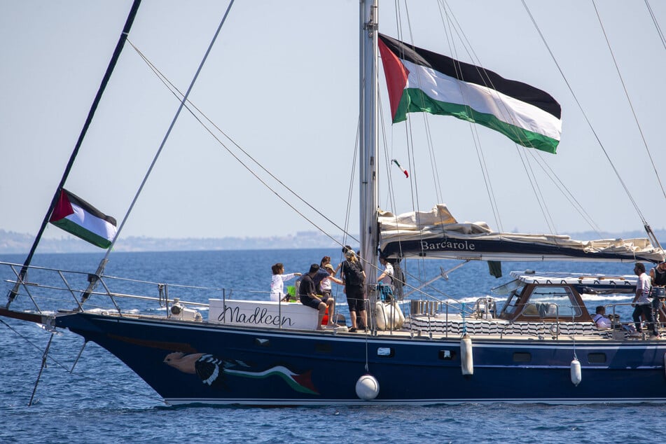 Palestine human rights activists stand on the deck of the Madleen freedom flotilla boat on June 1, 2025, as it prepares to set sail for Gaza.