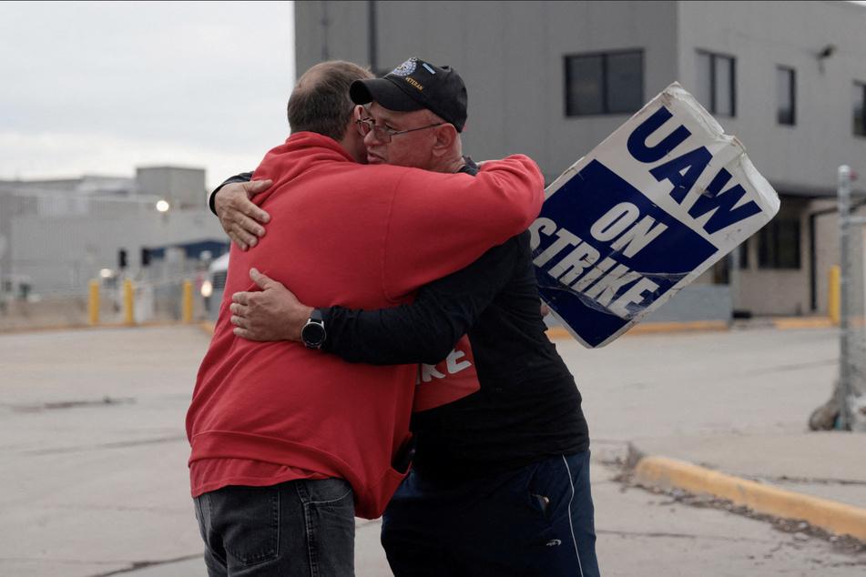 Two striking UAW members hug goodbye at the end of their picket shift outside the Ford Michigan Assembly Plant in Wayne.