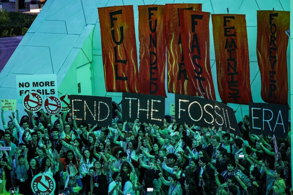 Activists take part in a protest against fossil fuels during the United Nations Climate Change Conference (COP28) in Dubai on December 12, 2023.