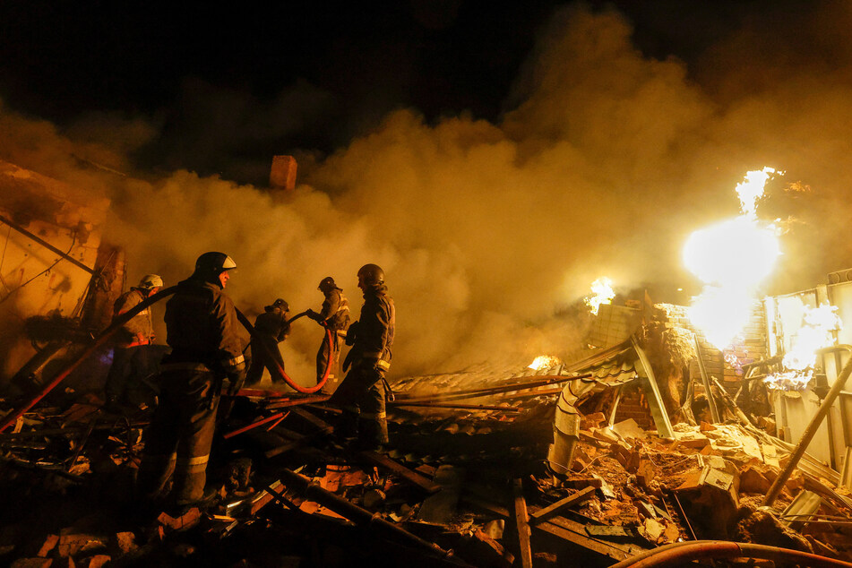 Firefighters work to extinguish fire in the aftermath of shelling in the Russian-controlled Donetsk region of Ukraine.