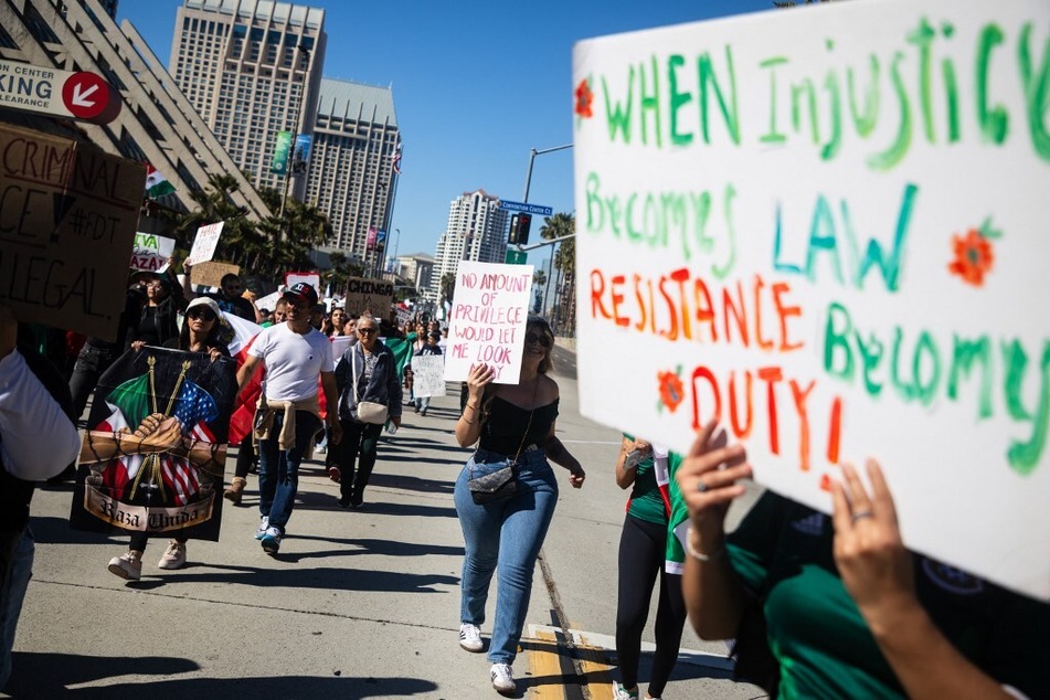 Demonstrators rally in support of immigrants under assault by the Trump administration in San Diego, California, on February 2, 2025.