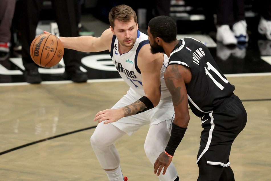 Dallas Mavericks guard Luka Doncic controls the ball against Brooklyn Nets guard Kyrie Irving during the first quarter at Barclays Center.